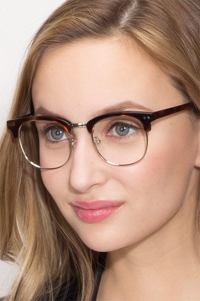 a woman wearing Borderline in color Browline Tortoisea and 5 trendy readers for 2023