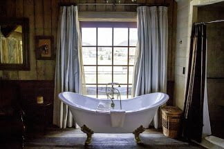 a photo of a bath tub in a glamping area and 5 seriously cool glamping spots to visit in 2023