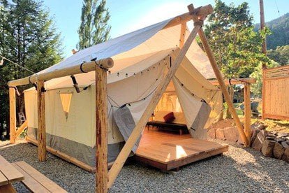 a photo of a glamping tent and 5 seriously cool glamping spots to visit in 2023